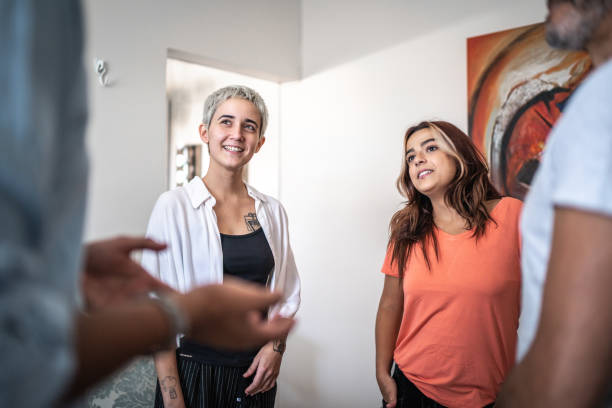 istock Friends talking in living room 1460556225