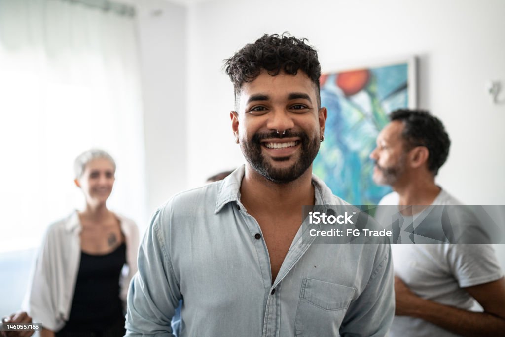 Portrait of a young man in the living room at home Nose Ring Stock Photo