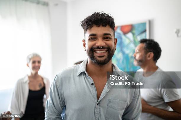 Portrait Of A Young Man In The Living Room At Home Stock Photo - Download Image Now - Nose Ring, Real People, 25-29 Years