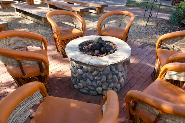 istock Leather and bamboo club chairs gathered around the fire pit 1460563034