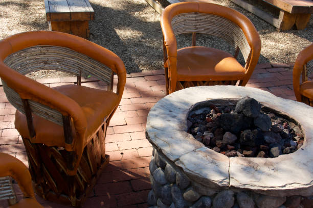 istock Leather and bamboo club chairs gathered around the fire pit 1460563042