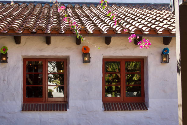 Old adobe building with deep inset casement windows
