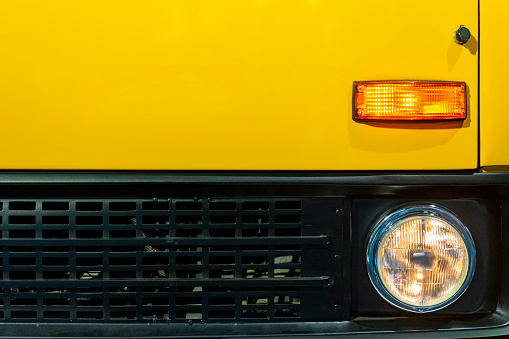yellow bus, front, lights,