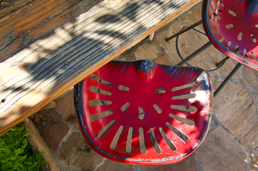 Rustic bar stools from repurposed tractor seats