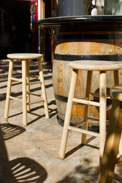 istock Wine barrel table and a pair of bar stools 1460563652