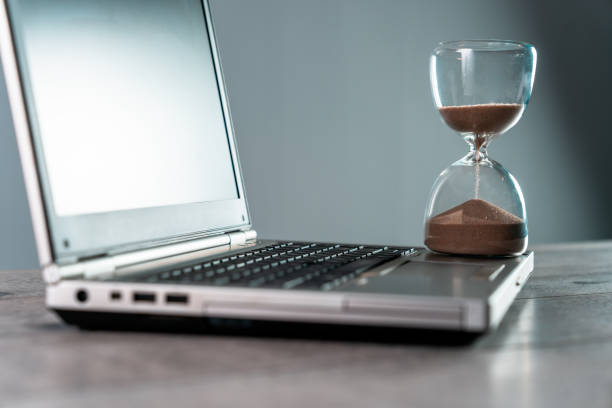 istock Laptop and hourglass 1460565449
