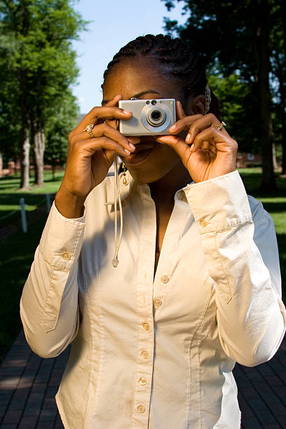 istock African American College Student Shooting Camera 146056675