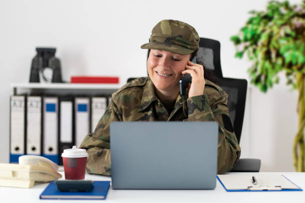 istock woman soldier working at office 1460571438