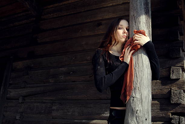 Close up portrait of a gorgeous brunette, background is a defocused city.
