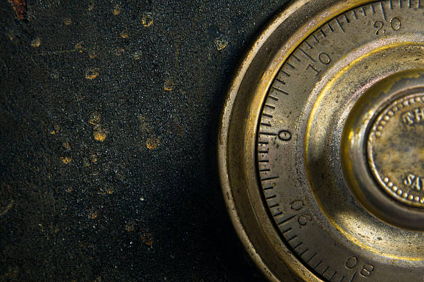 Antique Safe Close-up of a combination dial on an antique safe. safes and vaults stock pictures, royalty-free photos & images