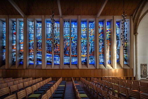 Brunswick, Germany - Jan 15, 2020: Glass windows by Gottfried von Stockhausen showing the Children of Israel crossing the Red Sea at St. Magni Church - Braunschweig, Germany