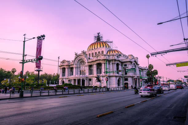 Mexico City, Mexico; January 25, 2023: Palace of Fine Arts in the city, under an evening sky, violet colors, sunset.