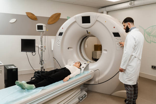 istock Computed tomography CT scan process for examination brains. CT scanning of the brains examination to assess head injuries, severe headaches, dizziness, bleeding and stroke, brain tumors. 1460581439