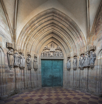 Magdeburg, Germany - Jan 15, 2020: Door and early gothic sculptures of the Ten Wise and Foolish Virgins at the Gate of Paradise at Magdeburg Cathedral Interior - Magdeburg, Germany