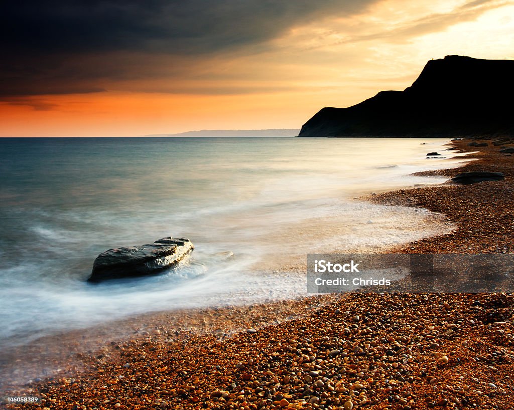 Eype pôr-do-sol na praia - Foto de stock de Arrebentação royalty-free