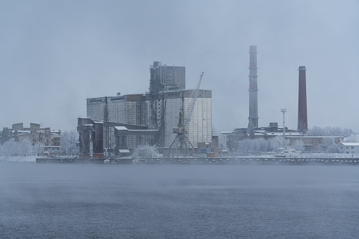 Daugava river and a fragment of the port of Riga in a winter morning