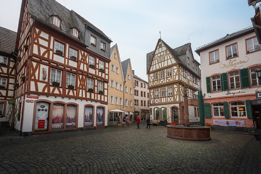 Mainz, Germany - Jan 22, 2020: Kirschgarten Square with half-timbered buildings and Marienbrunnen fountain - Mainz, Germany