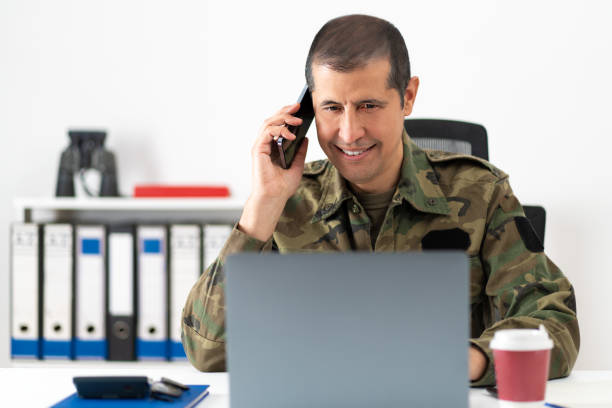 istock happy soldier talking by phone at the office 1460587015