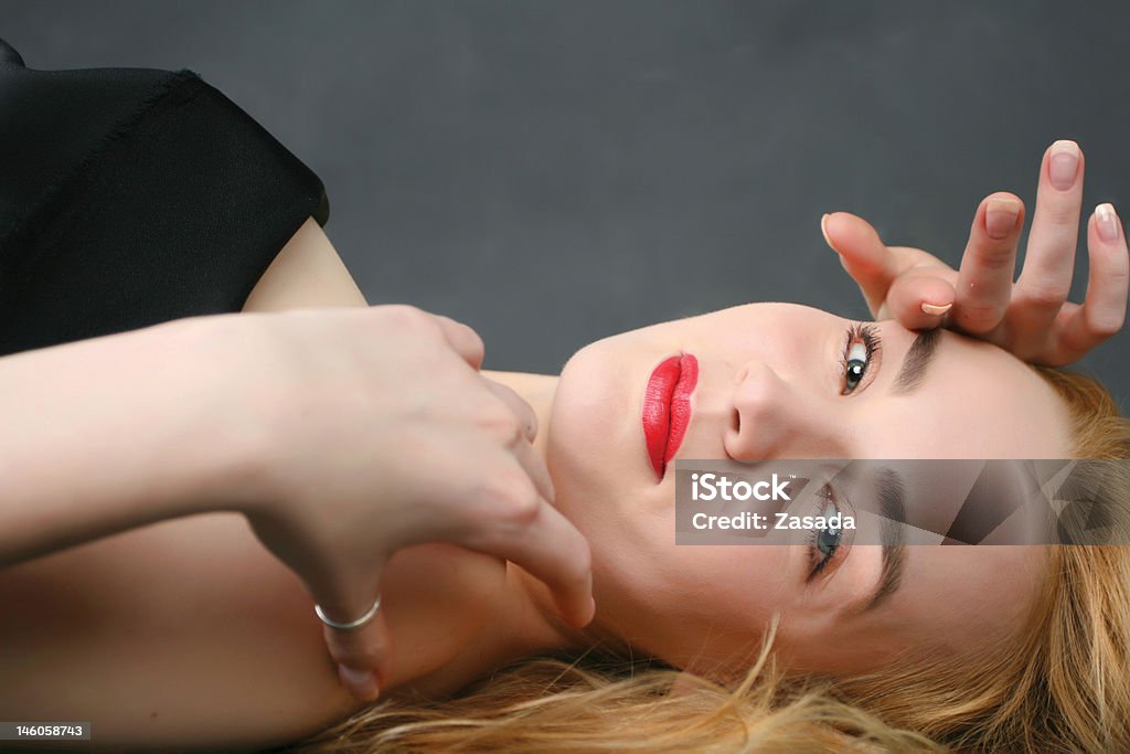 blond woman lying on the floor-2 blond woman lying on the floor Adult Stock Photo