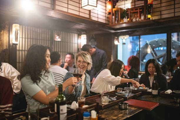 istock Two Female Colleagues Toasting After Work At A Japanese Bar 1460592032