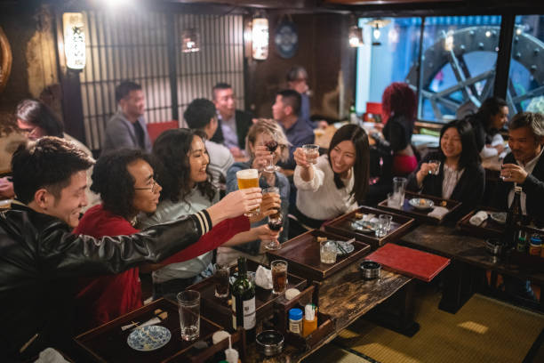 istock Team Of Work Colleagues Having Some Drinks After Work At An Izakaya 1460592045