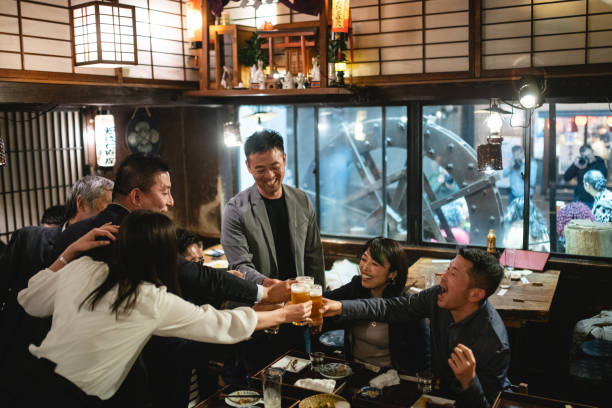 istock Asian Employees Toasting Together After Work With Some Beers 1460592262