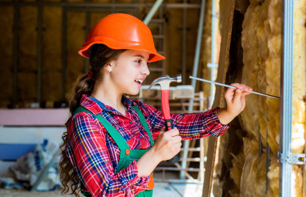 happy kid engineer with hammer tool in hard hat, engineering happy kid engineer with hammer tool in hard hat, engineering. girl with a hammer stock pictures, royalty-free photos & images