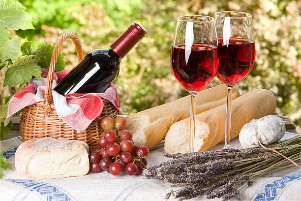 istock Summer picnic containing wine, bread and grapes 146059379