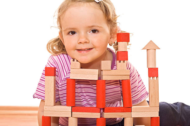 istock Little girl playing with wooden blocks 146059529
