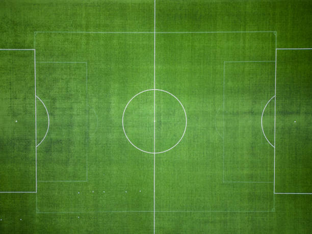 istock empty green grass soccer field, aerial view 1460596095