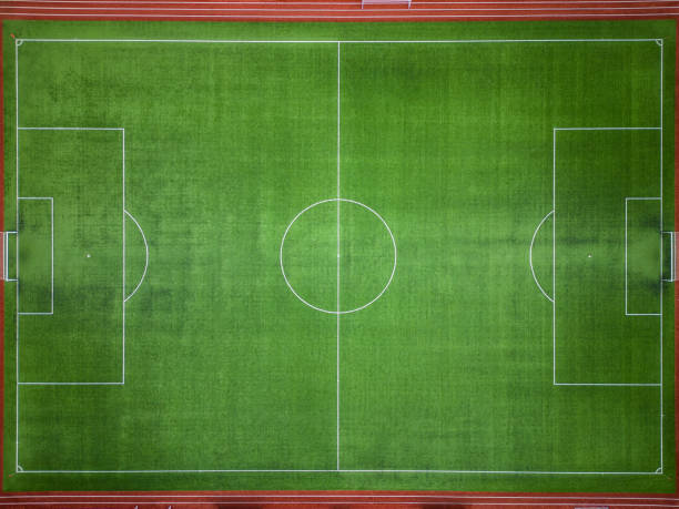 istock empty green grass soccer field, aerial view 1460596096