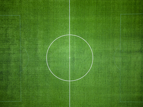 aerial view green soccer field. Football stadium sized to FIFA standards. drone shooting