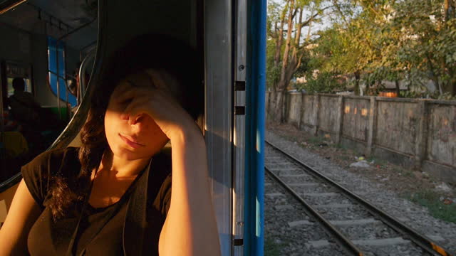 Young woman sleeping in the train
