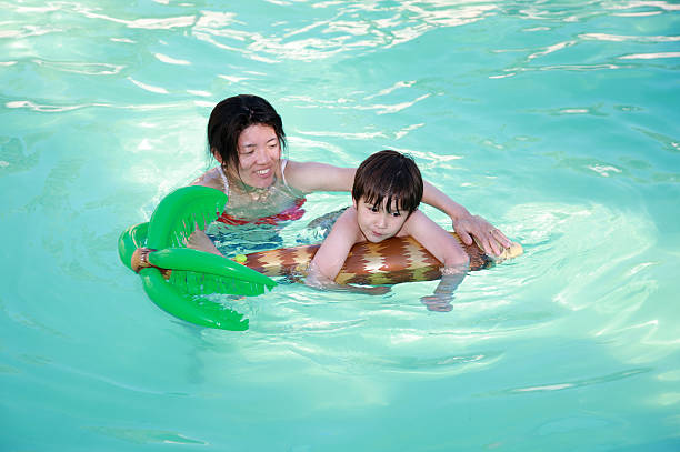 istock Mom and Son swimming 146059982