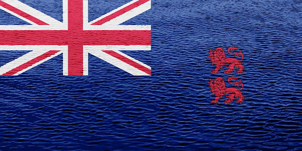Flag of the British Overseas Territory of the officially the Sovereign Base Areas of Akrotiri and Dhekelia on a textured background. Concept collage.