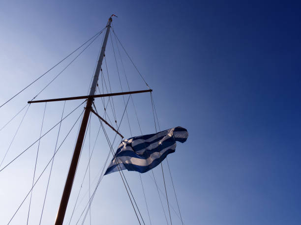 istock Greek flag floating in a sailing boat 1460602761