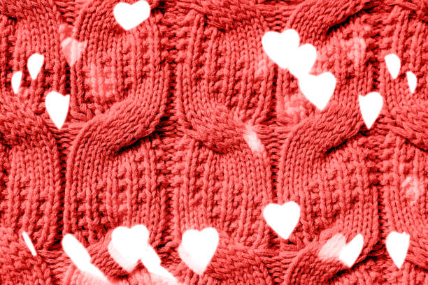 istock Beautiful handmade knitted repeating pattern. Festive bokeh background in the form of hearts for Valentine's Day 1460603356