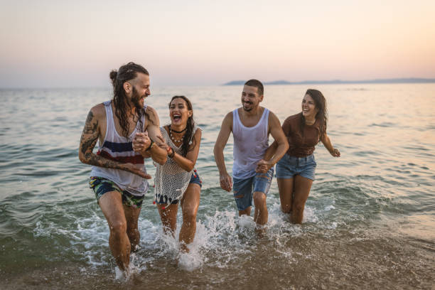 istock Best friends having fun in the sea 1460608706