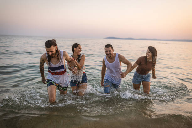 istock Best friends having fun in the sea 1460608890