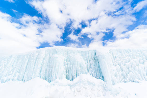 A large wall of frozen icicles on a sunny cold day in North Japan.