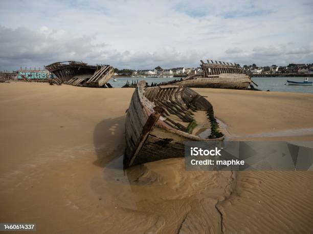 Stranded Broken Wooden Shipwrecks On Fishing Boat Naval Graveyard Marine Cemetery In Magouer Etel River Brittany France Stock Photo - Download Image Now