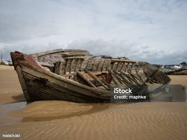 Stranded Broken Wooden Shipwrecks On Fishing Boat Naval Graveyard Marine Cemetery In Magouer Etel River Brittany France Stock Photo - Download Image Now