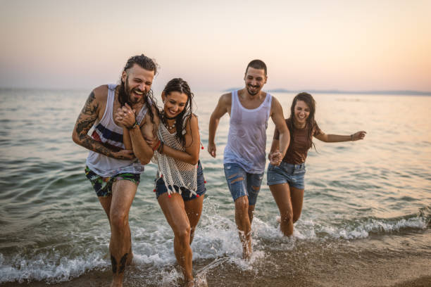 istock Best friends having fun in the sea 1460614422