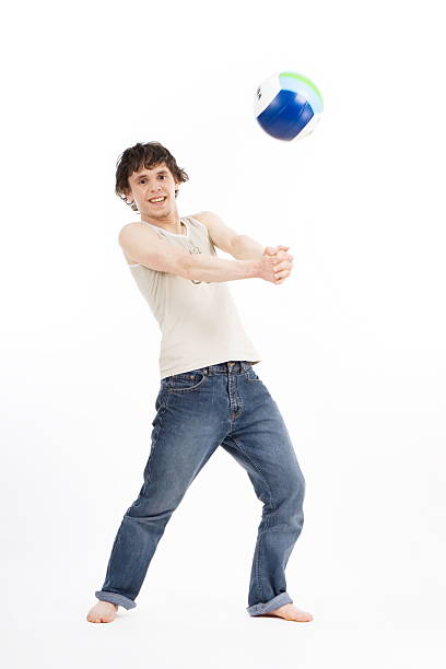 istock young man playing volleyball 146061510