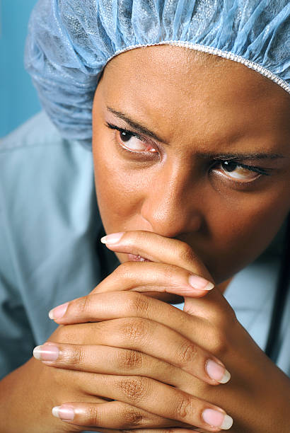 Sad and unhappy nurse stock photo