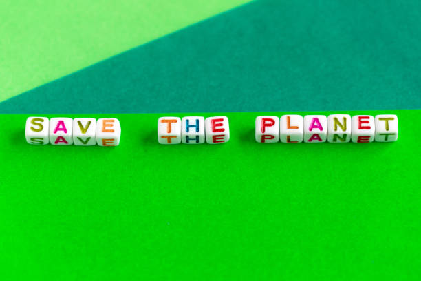 istock Phrase Save the planet made out of beads on bright green background 1460618331