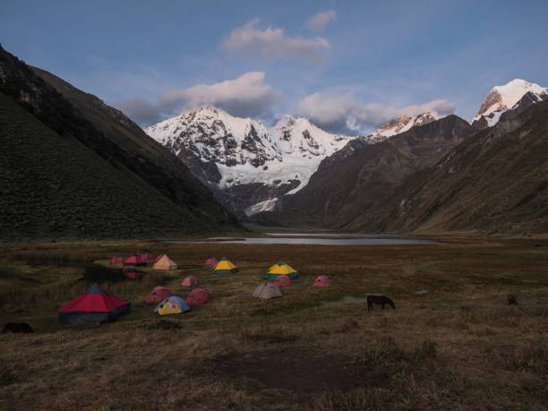 Sunrise panorama of andes mountain Jirishanca tent Camp Jahuacocha lake Cordillera Huayhuash Circuit Ancash Peru stock photo