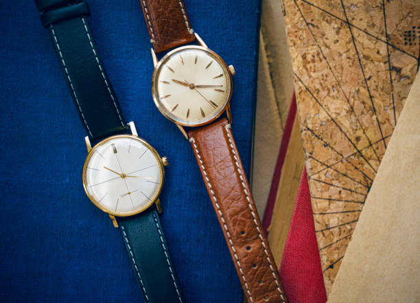 istock Two vintage automatic watches on old books 1460620928