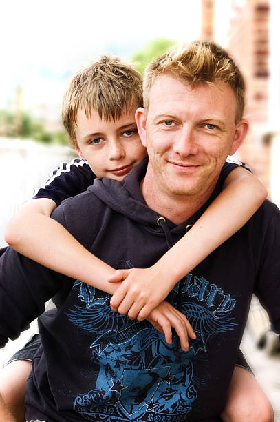 istock Photo of a son riding on his father's back 146062163