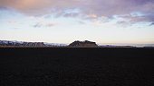 Panorama of black rock volcanic sand mountain landscape near Solheimasandur DC3 airplane wreck South Iceland Europe